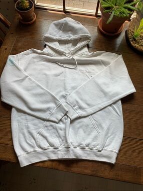 Koatity white hoodie with Barstool logo on left arm.